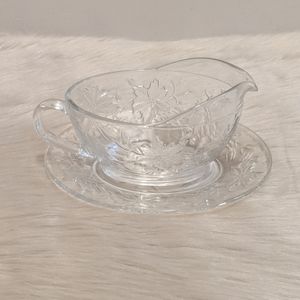 Vintage glass with pretty pointseta gravy boat with saucer.
